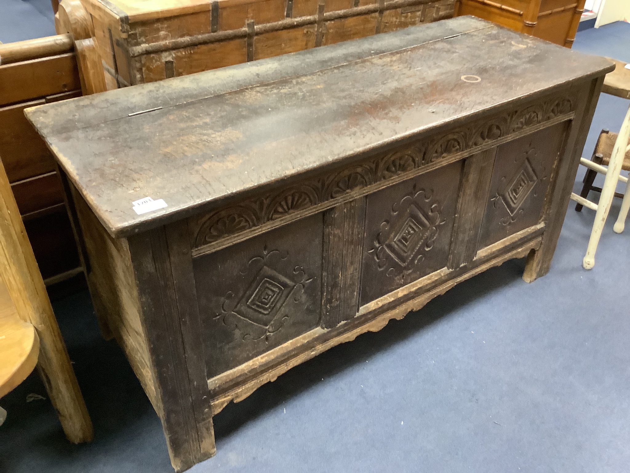 An eary 18th century carved oak coffer